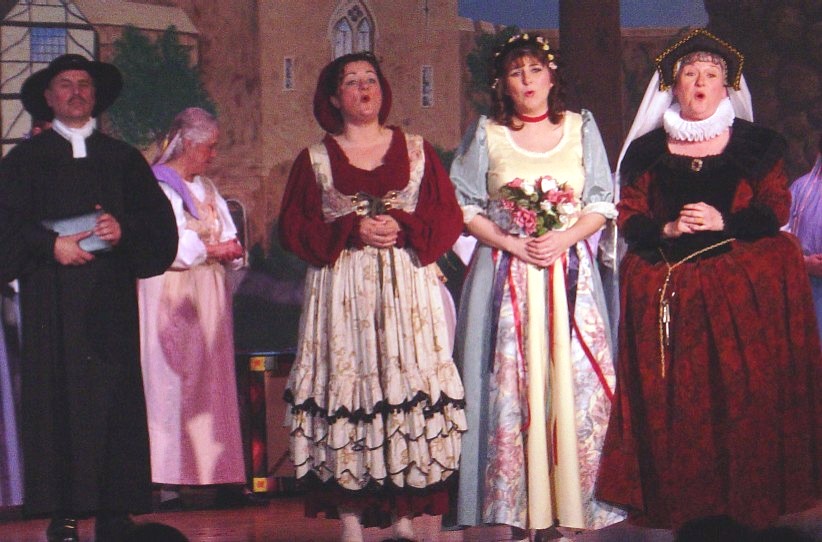 Sam in The Yeomen of the Guard 2003, with Micky Molongoski — 'Phoebe', Kathy Perconti — 'Elsie' and Lynette Blake — 'Dame Carruthers'